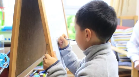 Asian boy learning caculation on white board Stock Footage 49938902