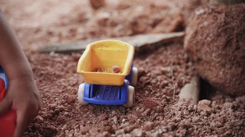 Asian boy playing and digging soil using toy Video stock 95819266