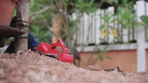 Asian boy playing and digging soil using toy Video stock 117266261