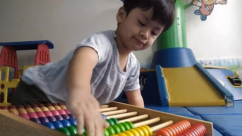 Asian boy playing big abacus, 스톡 동영상 70790221