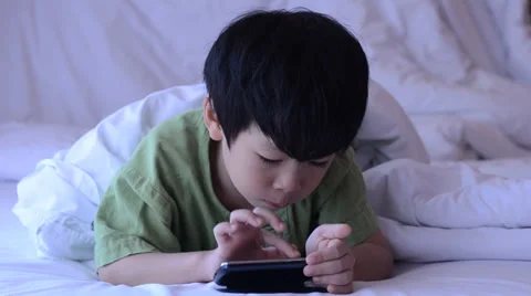 Asian boy playing games Stock Footage 37191590