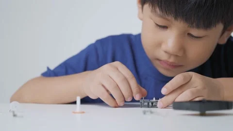 Asian boy playing with gear kit. Stock Footage 156603915