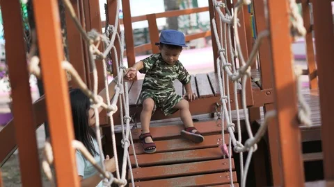 Asian boy playing at kid training playground Stock Footage 86507672