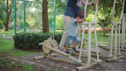 Asian boy playing at kid training playground with his mother Video stock 90411572