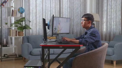 Asian Boy Programmer Learning Online From Teacher On Desktop Computer While Stock Footage 233461384