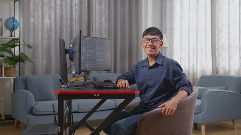 Asian Boy Programmer Smiling To Camera While Creating Software Engineer Stock Footage 233460972