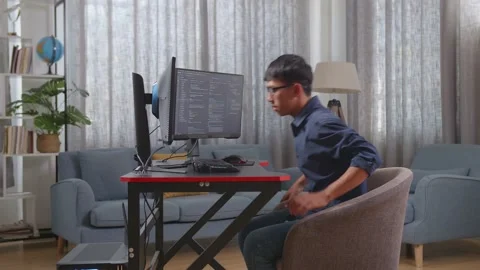 Asian Boy Programmer Walking Into The Working Space Before Sitting To Creating Stock Footage 233461343