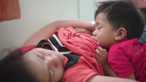 Asian boy sleeping while breastfeeding Video stock 88629866
