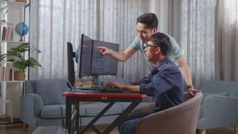 Asian Boy Students Studying Software Code From Male Teacher Or Father Stock Footage 233461526