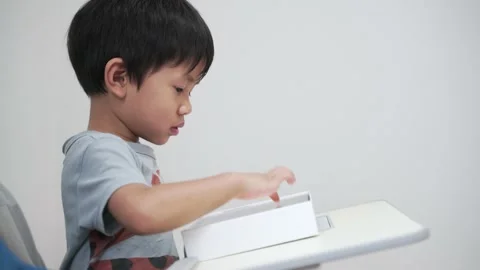 Asian boy using computer tablet Stock Footage 146833533