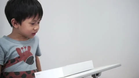 Asian boy using computer tablet Stock Footage 174018914