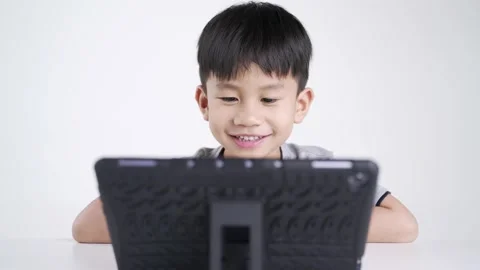 Asian boy using a computer tablet Stock Footage 174019467
