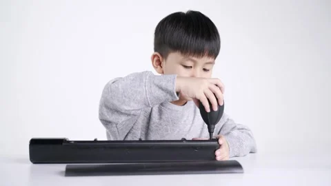 Asian boy using rubber bulb air pump dust blower Video stock 147337189