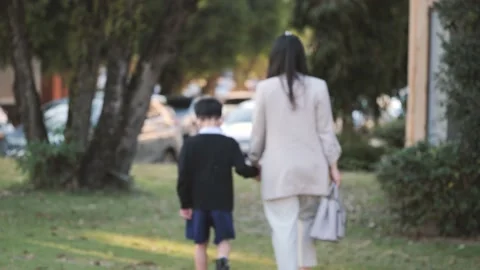 Asian boy walking while holding his mother hand. Stock Footage 171094247