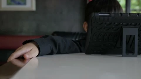 Asian boy watching computer tablet with a medical face mask. Stock Footage 196663305
