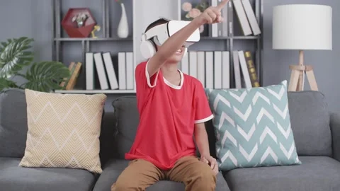 Asian boy wearing virtual reality googles Stock Footage 157995065