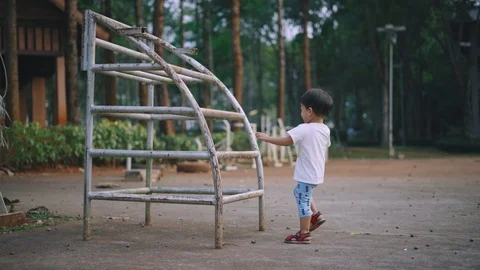 Asian boyclimbing and having fun Stock Footage 88825650