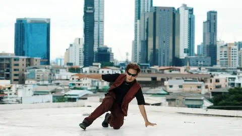Asian break dancer practice B boy dance with friends at roof top. Endeavor. 写真素材