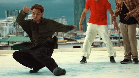 Asian break dancer practice B boy dance with friends at roof top. Endeavor. 写真素材
