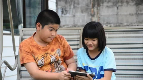 Asian brethren using tablet. Stock Footage 64722922