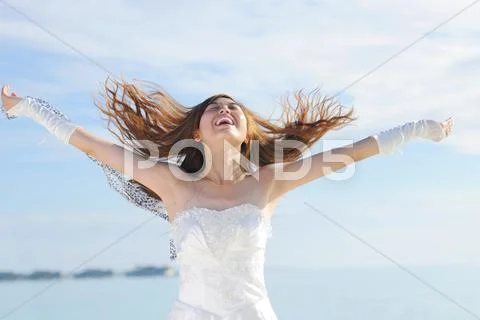 Asian bride on beach Stock Photos
