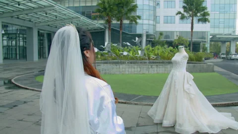 Asian Bride Examining Her Wedding Dress Details Outside Stock Footage 333356023