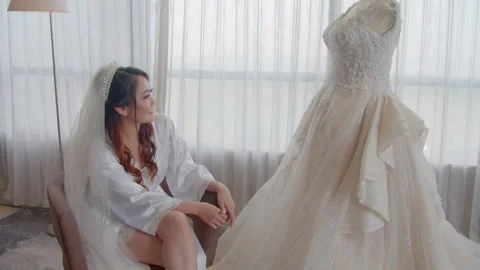 Asian Bride Examining Her Wedding Dress Details Outside Stock Footage 333358978