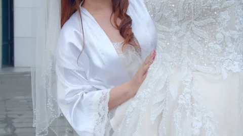 Asian Bride Examining Her Wedding Dress Details Outside Stock Footage 333375079
