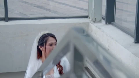 Asian Bride Taking Stair Looking Outside WIth Happy Face On Her Wedding Day Stock Footage 333358842