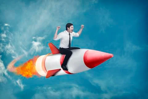 Asian business man flying ride rocket Stock Photos