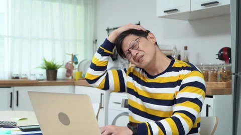 Asian business man using laptop Suffering From neck pain and stretching arm.. Stock Footage 252818804
