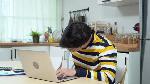 Asian business man using laptop Suffering From low back pain working at hom.. Stock Footage 252820035