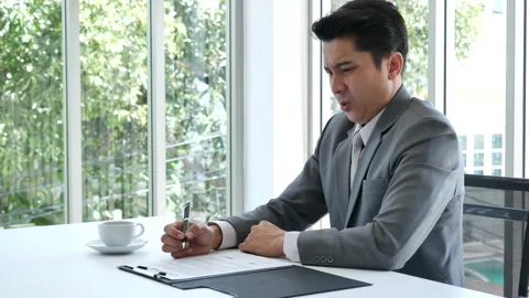 Asian business man using pen signing on new contract to starting projects Видео 264202622