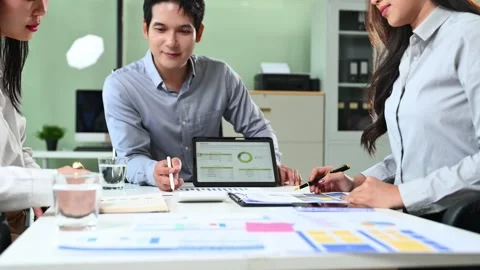 Asian business team analyzing performance data and financial strategy using.. Stock Footage 312442273