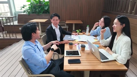 Asian Business Team High Five During Meeting on Outdoor Terrace Stock Footage 345119331