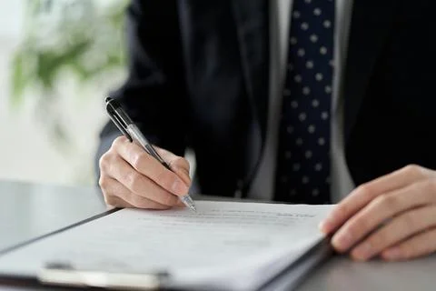 Asian businessman checking the content of documents Foto stock