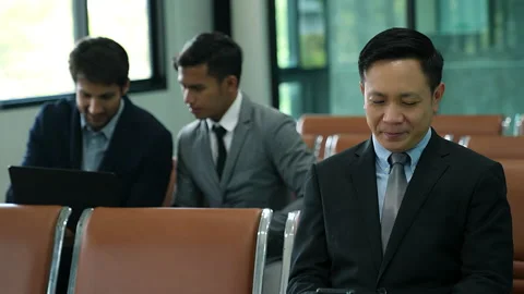 Asian businessman checking data on smart phone Stock Footage 237488154