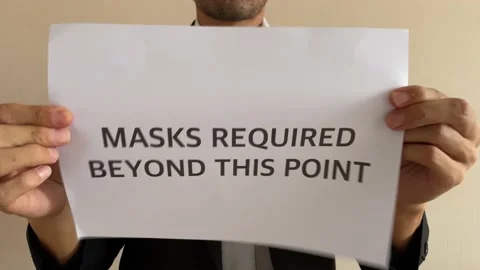 Asian businessman crumpling paper “MASK REQUIRED BEYOND THIS POINT” word Video stock 182276053