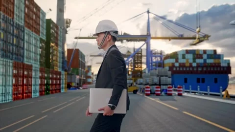 Asian Businessman Holding Computer While Walking at Port Ship Stock Footage 318816774