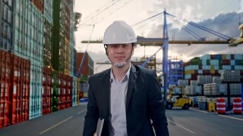 Asian Businessman Holding Computer While Walking at Port Ship Stock Footage 318817016