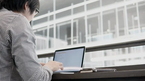 Asian businessman using laptop computer in working space Stock-Footage 90997575