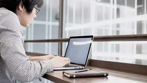 Asian businessman using laptop computer in working space Stock-Footage 91000824