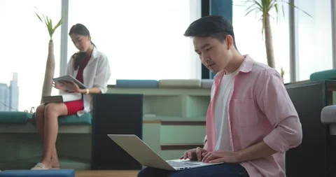 Asian businessman worked using laptop at coworking space in the office Stock-Footage 211414845