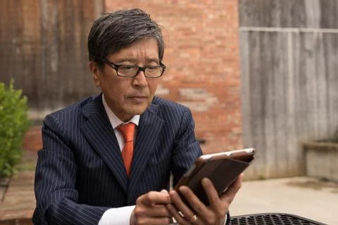 Asian businessman working outdoor Fotos de archivo