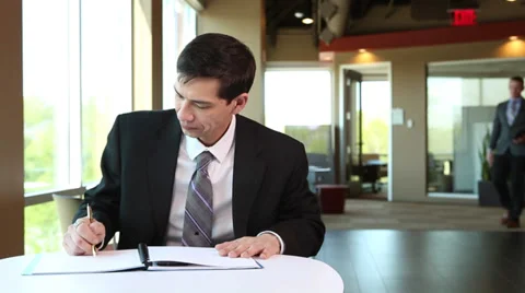 Asian Businessman writing notes 動画素材 35872637