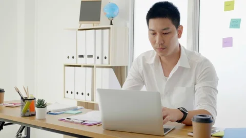 Asian businessmen work using laptops in modern offices. Having stress and worry  Stock-Footage 128823527