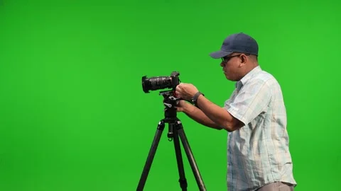 Asian camera man using tripod and camera Stock Footage 252871221