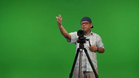 Asian camera man using tripod and camera Stock Footage 252871315