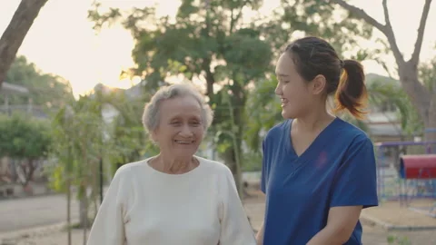 Asian careful caregiver and elderly female, Stock Footage 276263653
