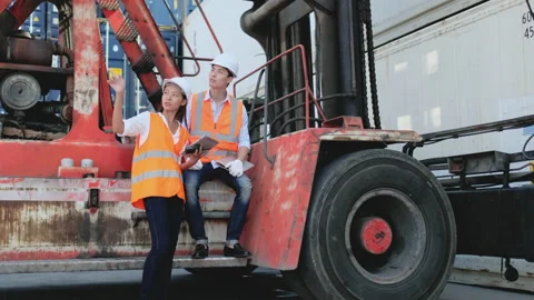 Asian cargo container worker man and woman work and discuss together Stock-Footage 146447165